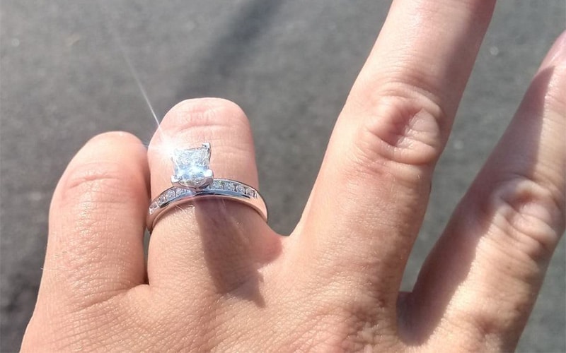 princess cut diamond ring sparkling in the sunlight